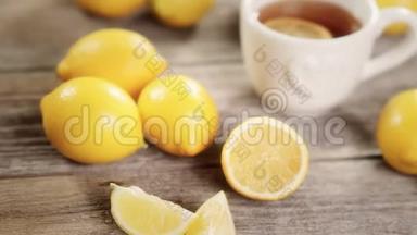 杯茶与柠檬在4k视频。 维生素C预防感冒的概念